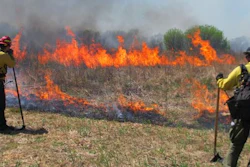 Fire crews keep watch over a controlled grass fire at the Homestead National Monument of America in Beatrice, Neb., on Friday, April 22, 2016. University of Nebraska-Lincoln researchers used the burn as a chance to test a drone that can start its own fires.