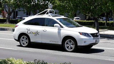 In this May 13, 2014 file photo, a Google self-driving car goes on a test drive near the Computer History Museum in Mountain View, Calif. Self-driving cars are more likely to be a threat than a boon to public safety because of unresolved technical issues, engineers and safety advocates told the government Friday, countering a push by innovators for expedited government approval.