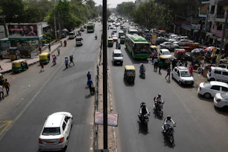Few vehicles are seen plying on the otherwise severely busy Mehrauli Badarpur road during rush hour in New Delhi, India, Friday, April 15, 2016. The New Delhi government has begun a second round of a two-week car restriction whereby private cars will be allowed on the streets on alternate days from Friday until April 30 based on even or odd license plate numbers, to reduce air pollution that has made the Indian capital the world's most polluted city.