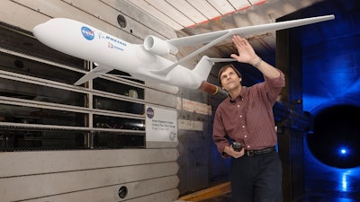Greg Gatlin, NASA aerospace research engineer from NASA’s Langley Research Center, inspects the truss-braced wing during testing in the Unitary Plan Wind Tunnel complex at NASA’s Ames Research Center in Silicon Valley.