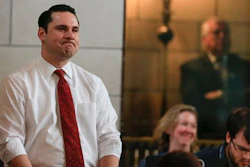 Nebraska state Sens. Heath Mello of Omaha, left, and Tanya Cook of Omaha, bottom right, react in Lincoln, Neb., Wednesday, April 20, 2016, after lawmakers overrode their Republican governor’s veto to approve a law allowing certain immigrants brought to the U.S. illegally as children to work in health care, education and dozens of other professions that require state licenses.