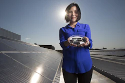 Dr. Xiaojing Hao of UNSW's Australian Centre for Advanced Photovoltaics holding the new CZTS solar cells.
