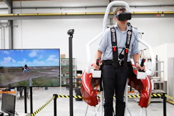 In this Feb. 9, 2016 photo, test pilot Michael van der Vliet operates a flight simulator at the Martin Aircraft Co. headquarters in Christchurch, New Zealand.