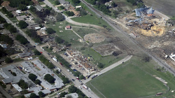 This April 18, 2013 aerial file photo shows the remains of a nursing home, left, apartment complex, center, and fertilizer plant, right, destroyed by an explosion at a fertilizer plant in West, Texas. Federal authorities announced Wednesday, May 11, 2016, that the fire that caused the deadly explosion in 2013 was a criminal act. The explosion killed 15 people, injured hundreds and left part of the small town in ruins.