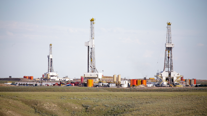 Three Hydro Fracking Derricks Drilling Natural Gas On A Plain 000067470117 Medium 572b52261af3f