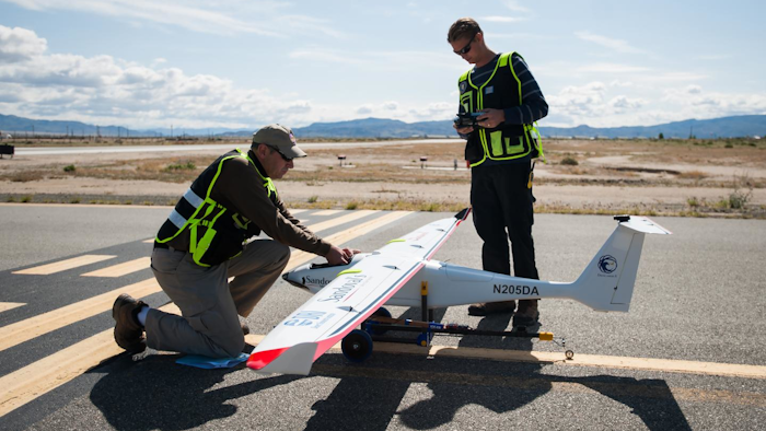 (From Left) Drone America's Todd Richman, pilot, and Kyle Pruett, engineer and pilot, prepare to test fly the Savant sUAS with cloud seeding flares at the Hawthorne Industrial Airport in Hawthorne, Nev. on Friday, April 29, 2016. The Savant flew to 400 feet and was successful in igniting two silver-iodide cloud seeding flares.