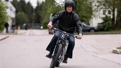 The CEO of Airbus, Tom Enders, presents the first 3D printed electric motorcycle in Ottobrunn, Germany, Friday May 20,2016. The motorcycle was made of metal powder by using lasermelting technology.