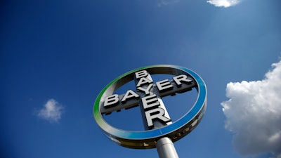 FILE - The Oct. 2, 2013 file photo shows the logo of the chemical company Bayer in Schoenefeld, Germany. The German drug and chemicals company Bayer AG confirmed Thursday, May 19, 2016 it has entered talks with the Monsanto Company about the possible acquisition of the U.S.-based specialist in genetically modified crop seeds.