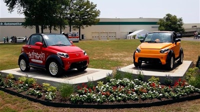 This July 6, 2012 photograph shows finished electric MyCars outside the GreenTech Automotive's manufacturing facility in Horn Lake, Miss. GreenTech Automotive is renegotiating its incentive deal with the state of Mississippi after state officials say the electric-vehicle maker failed to meet its 350-job employment target at its Tunica county plant.