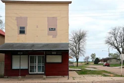A building stands on Cedar Street in Nickerson, Neb., Tuesday, April 19, 2016. When regional officials announced plans to open a $300 million chicken processing plant employing 1,100 workers, residents packed the firehall and the village board unanimously voted against the plant, and a week later the company gave up, saying they’d take their plant and jobs elsewhere.