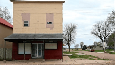 A building stands on Cedar Street in Nickerson, Neb., Tuesday, April 19, 2016. When regional officials announced plans to open a $300 million chicken processing plant employing 1,100 workers, residents packed the firehall and the village board unanimously voted against the plant, and a week later the company gave up, saying they’d take their plant and jobs elsewhere.