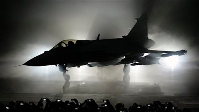 The new E version of the Swedish JAS 39 Gripen multi role fighter being rolled out at SAAB in Linkoping, Sweden, Wednesday, May 18, 2016.