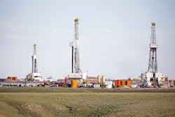 Three Hydro Fracking Derricks Drilling Natural Gas On A Plain 000067470117 Medium 572b52261af3f
