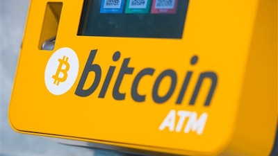 This is a Oct. 16, 2015 file photo of a Bitcoin ATM. An Australian man long thought to be associated with the digital currency Bitcoin has publicly identified himself as its creator.