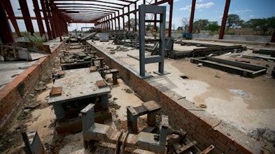 This March 21, 2016 photo shows a railroad factory in ruins after it was abandoned by its Chinese managers in Zaraza, Guarico state, Venezuela. Now all but abandoned, it has become a symbol of economic collapse and a strategic Venezuela-China relationship gone adrift.