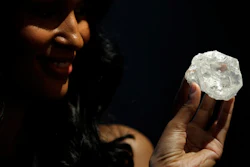 A model displays a large diamond at Sotheby's in New York, Wednesday, May 4, 2016. The auction house plans to offer the Lesedi la Rona diamond in London on June 29.