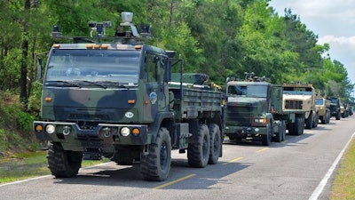 A convoy of driverless Army trucks.
