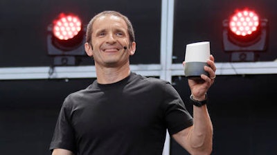 Google vice president Mario Queiroz holds up the new Google Home device during the keynote address of the Google I/O conference, Wednesday, May 18, 2016, in Mountain View, Calif. Google unveiled its vision for phones, cars, virtual reality and more during its annual conference for software developers.