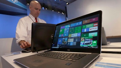 In this April 29, 2015, file photo, a Dell laptop computer running Windows 10 is on display at the Microsoft Build conference in San Francisco. In a statement issued to the BBC on May 24, 2016, Microsoft denied claims that it was forcing users of older Windows versions to upgrade to Windows 10.