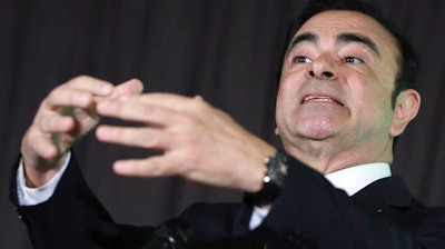 Nissan Motor Co. President and CEO Carlos Ghosn answers a question accompanying Mitsubishi Motors Corp. Chairman and CEO Osamu Masuko during their joint press conference in Yokohama, near Tokyo, Thursday, May 12, 2016. Nissan Motor Co. is taking a 34 percent stake in scandal-ridden Mitsubishi Motors Corp. in what Ghosn said was 'a win-win' deal. Ghosn said Nissan will invest 237 billion yen ($2.2 billion) to become the top investor in Mitsubishi Motors.