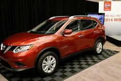 In this Tuesday, Sept. 10, 2013, file photo, the Nissan 2014 Rogue is unveiled in Farmington Hills, Mich. Nissan is recalling more than 108,000 Rogue small SUVs in the U.S. because the rear hatch door could fall on people without warning. The recall covers Rogues from the 2014 to 2016 model years.