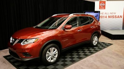 In this Tuesday, Sept. 10, 2013, file photo, the Nissan 2014 Rogue is unveiled in Farmington Hills, Mich. Nissan is recalling more than 108,000 Rogue small SUVs in the U.S. because the rear hatch door could fall on people without warning. The recall covers Rogues from the 2014 to 2016 model years.