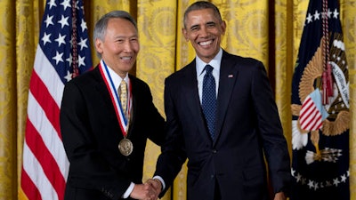 President Barack Obama shakes hands with Dr. Chenming Hu of the University of California, Berkeley, after awarding him the National Medal of Technology and Innovation, Thursday, May 19, 2016, during a ceremony in the East Room of the White House in Washington.
