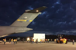 The OSIRIS-REx spacecraft is unloaded from a US Air Force C-17 cargo plane at NASA's Kennedy Space Center Shuttle Landing Facility.