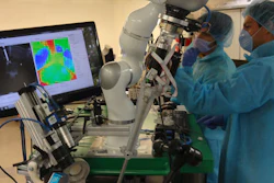 This photo provided by Axel Krieger/Science Translational Medicine shows Dr. Azad Shademan and Ryan Decker during supervised autonomous in-vivo bowel anastomosis performed by the Smart Tissue Autonomous Robot (STAR). Scientists have created a robot that stitched up tissue in living animals without a real doctor pulling the strings.