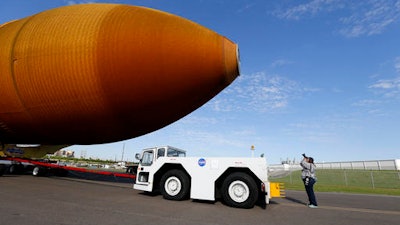 In this Sunday, April 10, 2016 file photo, external Tank, ET- 94, NASA's only remaining space shuttle external tank, is transported by trailer to a dock at the NASA Michoud Assembly Facility in New Orleans. The tank is embarking on a journey, via the Gulf of Mexico and the Panama Canal, to the California Science Center in Los Angeles, as part of the Space Shuttle Endeavour display. The tank ET-94 is scheduled to arrive Wednesday, May 18, 2016, in Los Angeles and then head later in the week to the science center.