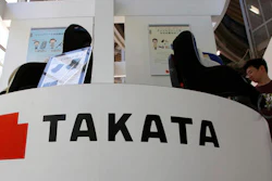 In this May 4, 2016 file photo, visitors look at child seats, manufactured and displayed by Takata Corp. at an automaker's showroom in Tokyo. Money-losing Japanese air bag maker Takata Corp. hired financial advisory and asset management firm Lazard Thursday, May 26 to help tackle financial problems and massive recalls.