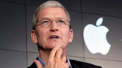 In this April 30, 2015 file photo, Apple CEO Tim Cook responds to a question during a news conference at IBM Watson headquarters, in New York.
