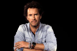 American entrepreneur, author, philanthropist and founder of Toms Shoes, Blake Mycoskie, poses during an interview in Los Angeles on Friday, May 6, 2016. Mycoskie, 39, reflects on 10 years of one-for-one giving and spoke about how he learned from his mistakes. To date, Toms has given away about 60 million pairs of shoes.