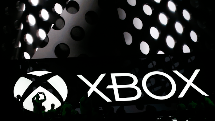 Members of the media attend a briefing at the Electronic Entertainment Expo in Los Angeles on Monday, June 13, 2016. Microsoft unveiled a new, slimmer version of the video game console coming later this year and a more powerful one that's due in 2017.