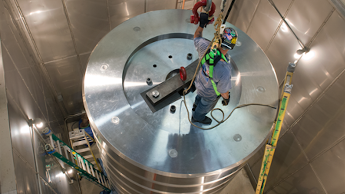 Rigging crew reassembling the million-pound weight stack in March 2016.