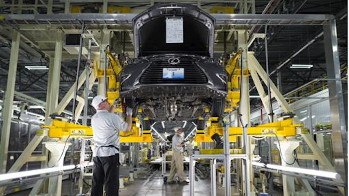 This Oct. 5, 2015, photo provided by Toyota shows workers at a Lexus Plant in Georgetown, Ky. Toyota is marking the 30th anniversary since work started on the Georgetown plant and has a ceremony scheduled Wednesday, June 8, 2016, to celebrate.