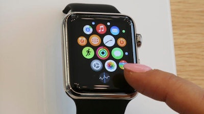 In this April 10, 2015, file photo, a customer demonstrates the Apple Watch at an Apple Store in Tokyo. At a keynote in San Francisco on Monday, June 13, 2016, Apple is expected to show off new features for its Apple Watch and other software.