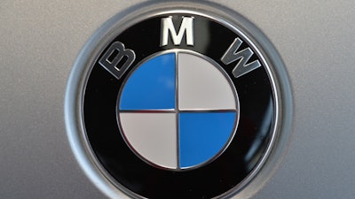 This file photo, shows the company logo of car manufacturer BMW. The company announced that it is recalling nearly 189,000 SUVs in the U.S. because the child seat anchors may become damaged and won't hold the seat properly.