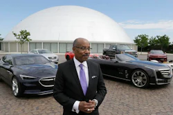 Ed Welburn, head of global design for General Motors, stands next to company concepts and production vehicles on the grounds of the company's Technical Center in Warren, Mich.