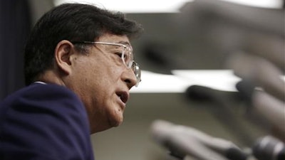In this May 11, 2016 photo, Mitsubishi Motors Corp. Chairman and CEO Osamu Masuko, answers a question during a press conference in Tokyo. The Japanese government said Tuesday, June 21, 2016 that Mitsubishi Motors Corp. overstated mileage on its vehicles by up to 16 percent, but stopped short of slapping further penalties on the company.