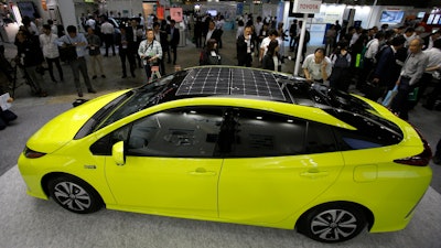 Toyota Motor Corp.'s Prius PHV is displayed at the Smart Community Japan exhibition in Tokyo Wednesday, June 15, 2016.