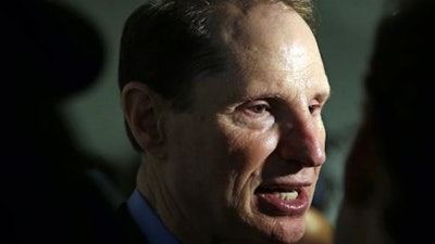 In this Friday, Sept. 25, 2015, file photo, U.S. Sen. Ron Wyden, D-Ore., speaks after a news conference in Portland, Ore. Wyden is pushing for more answers on why doctors and patient advocates with financial ties to the pharmaceutical industry came to serve on a panel that advises the federal government on pain issues.