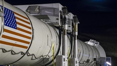 The moon rises ahead of the second and final qualification motor (QM-2) test for the Space Launch System's booster, Tuesday, June 28, 2016, at Orbital ATK Propulsion Systems test facilities in Promontory, Utah. During the Space Launch System flight the boosters will provide more than 75 percent of the thrust needed to escape the gravitational pull of the Earth, the first step on NASA's Journey to Mars.