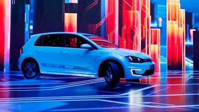In this Jan. 5, 2016 file photo Volkswagen unveils the e-Golf Touch electric car during a keynote address at CES International in Las Vegas, United States. CEO Matthias Mueller said Thursday, June 16, 2016, the company plans to introduce more than 30 electric-powered vehicles by 2025, and to sell 2 to 3 million of them a year.