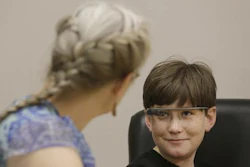 Julian Brown, right, talks with his mother Kristen during a meeting with Jena Daniels, a clinical research coordinator at The Wall Lab in Stanford, Calif., Wednesday, June 22, 2016. Like many autistic children, Brown, 10, has trouble reading emotions in people's faces, one of the biggest challenges for people with the neurological disorder. Now Brown is getting help from 'autism glass' - an experimental device that records and analyzes faces in real time and alerts him to the emotions they're expressing.