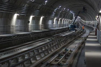 In this June 8, 2016 photo, men work in the new underground subway tunnel below Ipanema neighborhood in Rio de Janeiro, Brazil. Last-minute construction on the line has created fears after an April bike lane collapse that plunged two joggers to their deaths. An ocean-front section of the lane, an Olympic beautification project inaugurated in January, collapsed into a heap of broken cement when struck by a large wave.