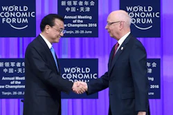 Founder and Executive Chairman of the World Economic Forum Klaus Schwab, right, shakes hands with Chinese Premier Li Keqiang during the World Economic Forum in Tianjin, China Monday, June 27, 2016.