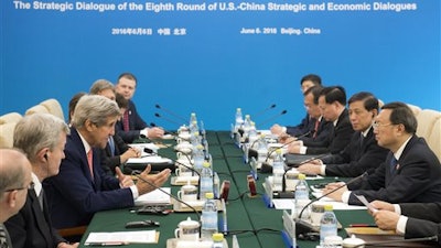 U.S. Secretary of State John Kerry, third left, speaks during a session on across from Chinese State Councilor Yang Jiechi, right, during a Strategic Track small session as part of the U.S.-China Strategic and Economic Dialogues at Diaoyutai State Guesthouse in Beijing Monday, June 6, 2016.