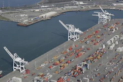 In this Feb. 5, 2016, file photo, the former Oakland Army Base pier at left and the Port of Oakland at lower right in Oakland, Calif. The promise of good, blue-collar jobs in a depressed area is running headlong into environmental sensitivities as officials in Northern California consider a plan to build a marine terminal that would serve as a gateway for Utah-mined coal heading to Asia. The terminal is in West Oakland, a historically black neighborhood that's among the poorest and most polluted in the region.