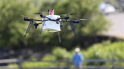 A drone aircraft with a payload of simulated blood, and other medical samples flies during a ship-to-shore delivery simulation Wednesday, June 22, 2016, in Lower Township, N.J. How to distribute lifesaving supplies quickly and safely after a natural disaster has long been a puzzle for responders. Now, drones might be the lifesaver. That idea was put to the test this week on the New Jersey coast as a drone delivery conducted test flights to help determine whether drones can be used to carry human medical samples to and from areas during major natural disasters.